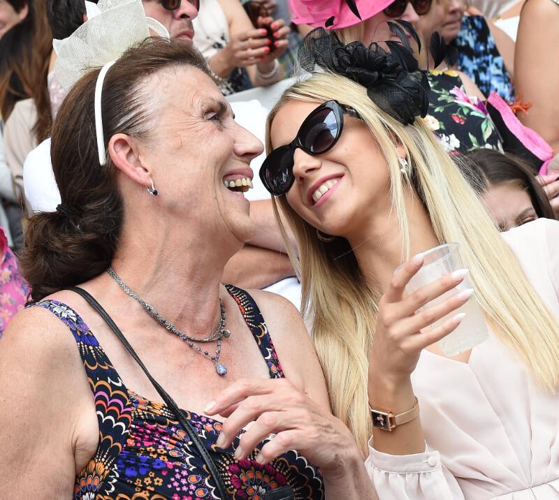 Two ladies enjoying their day at Royal Windsor Races