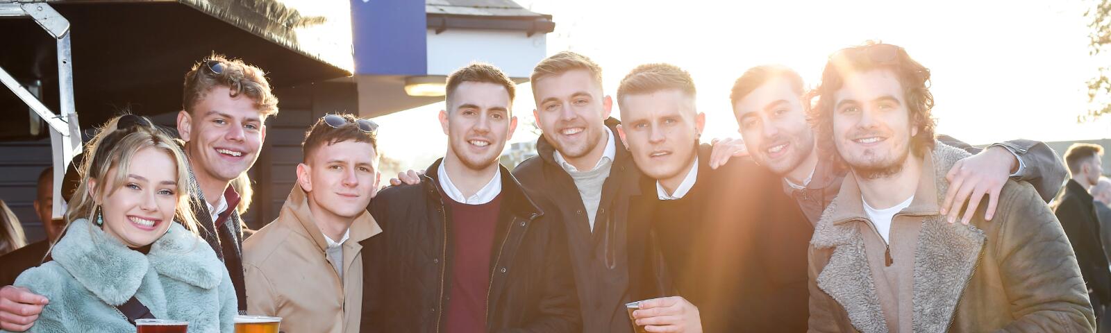 A large group of friends enjoy the races at Royal Windsor