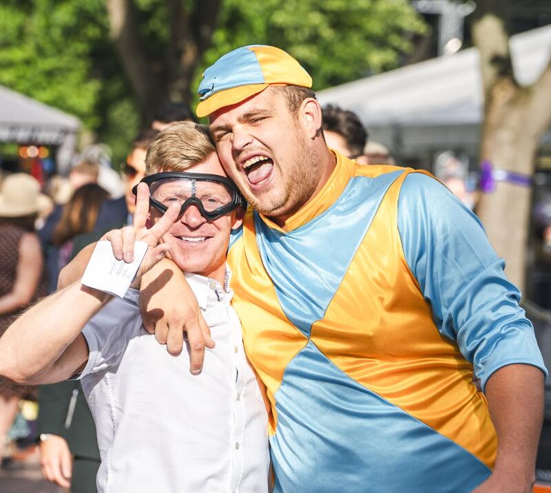 Two race goers dressed in jockey fancy dress at Windsor Races