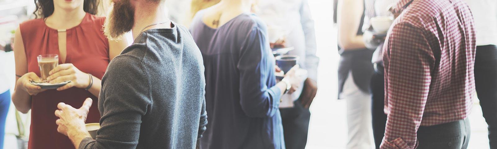 A crowd mingle and get to know each other over a few drinks