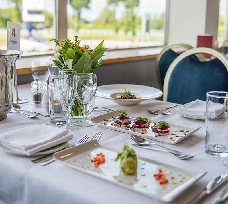 A finely set table with contemporary food on show.