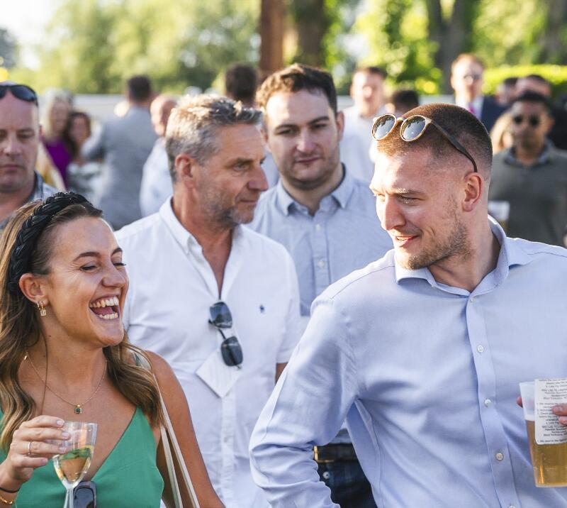 A group of race goers enjoying Gents Day at Windsor Racecourse.