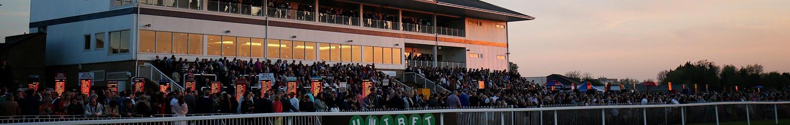 Windsor Racecourse grandstand at dusk