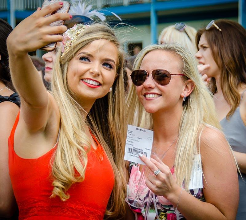 Two ladies at Royal Windsor ladies day taking a selfie