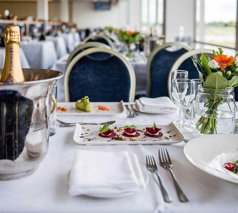 A neat and clean table with food and drinks on show.