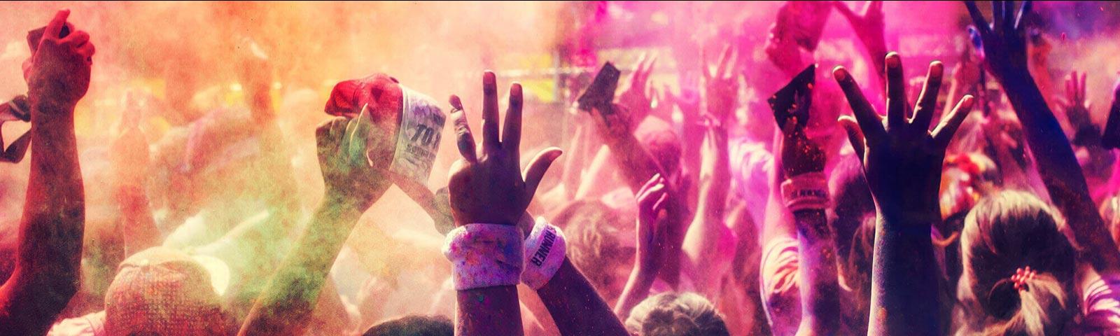 Crowds attending a colour run at Windsor Racecourse.